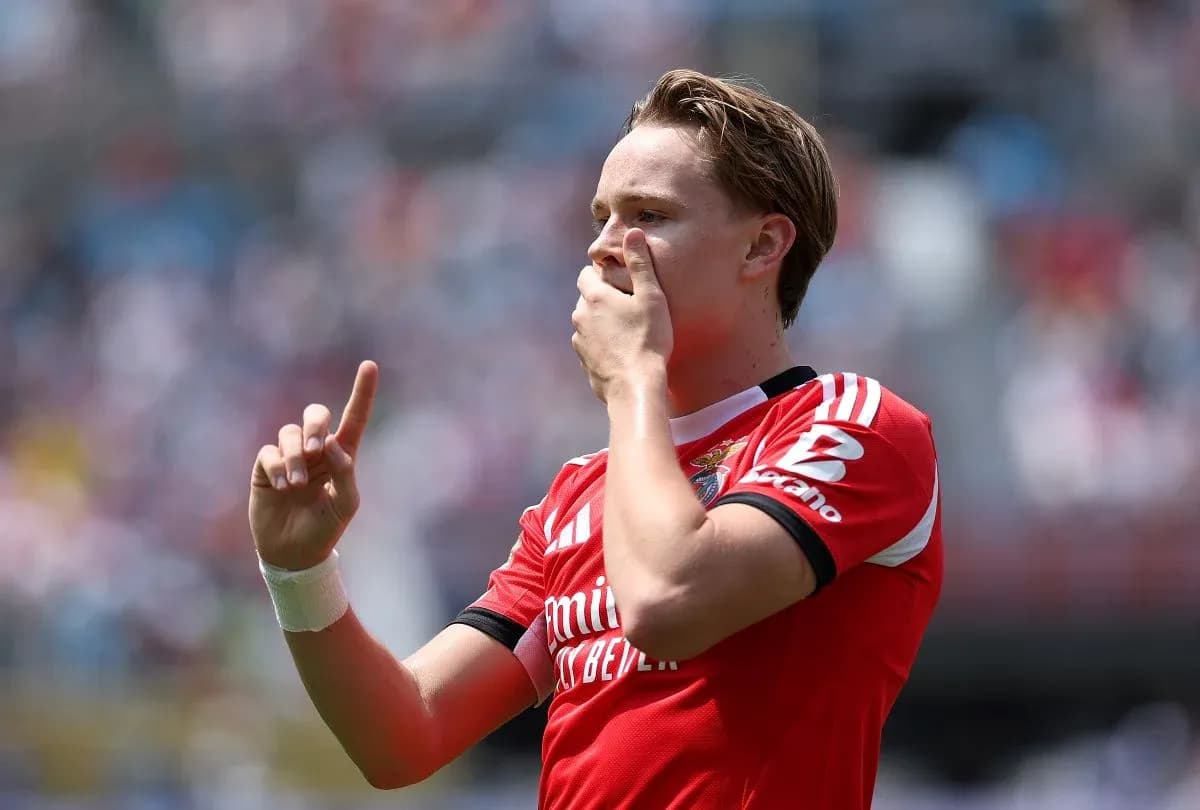 Player celebrating a goal with raised finger Player celebrating a goal with raised finger