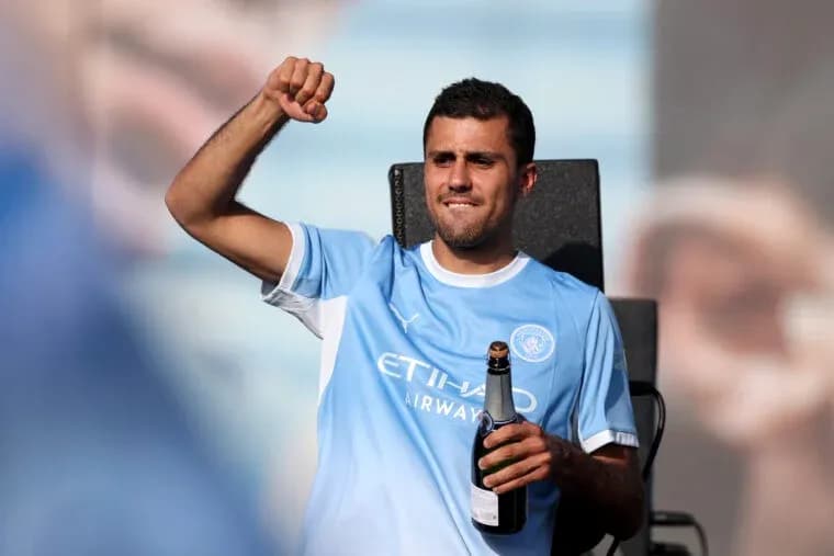 Player celebrating with champagne at event Player celebrating with champagne at event