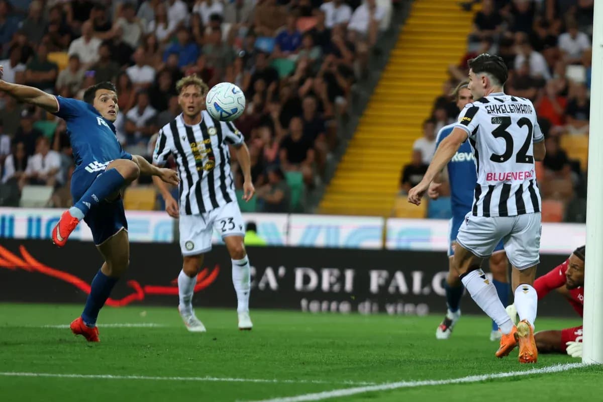 Udinese player attempting to intercept the ball Udinese player attempting to intercept the ball