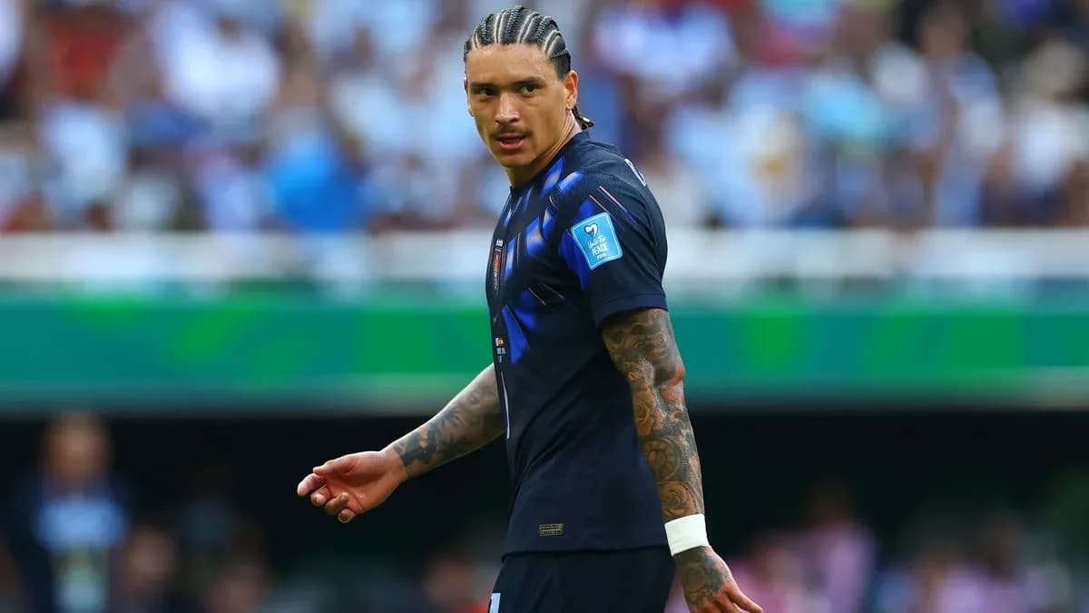Player in blue jersey on football pitch Player in blue jersey on football pitch