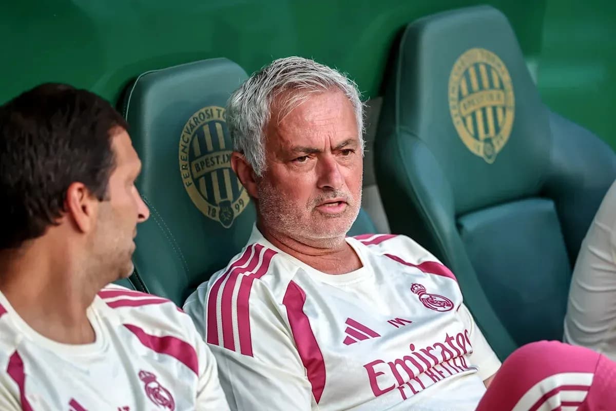 Coach and player sitting on team bench Coach and player sitting on team bench