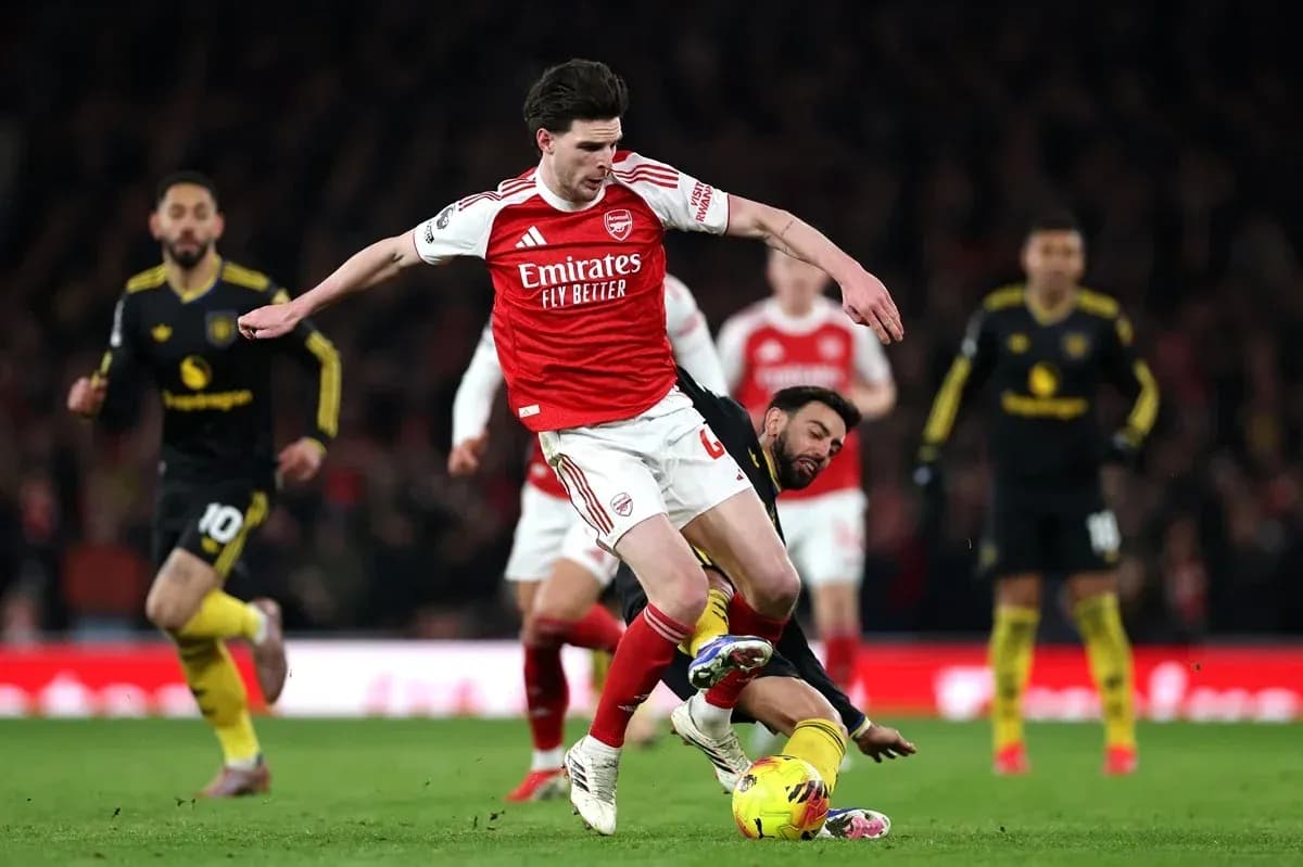 Player tackling opponent during Arsenal match Player tackling opponent during Arsenal match