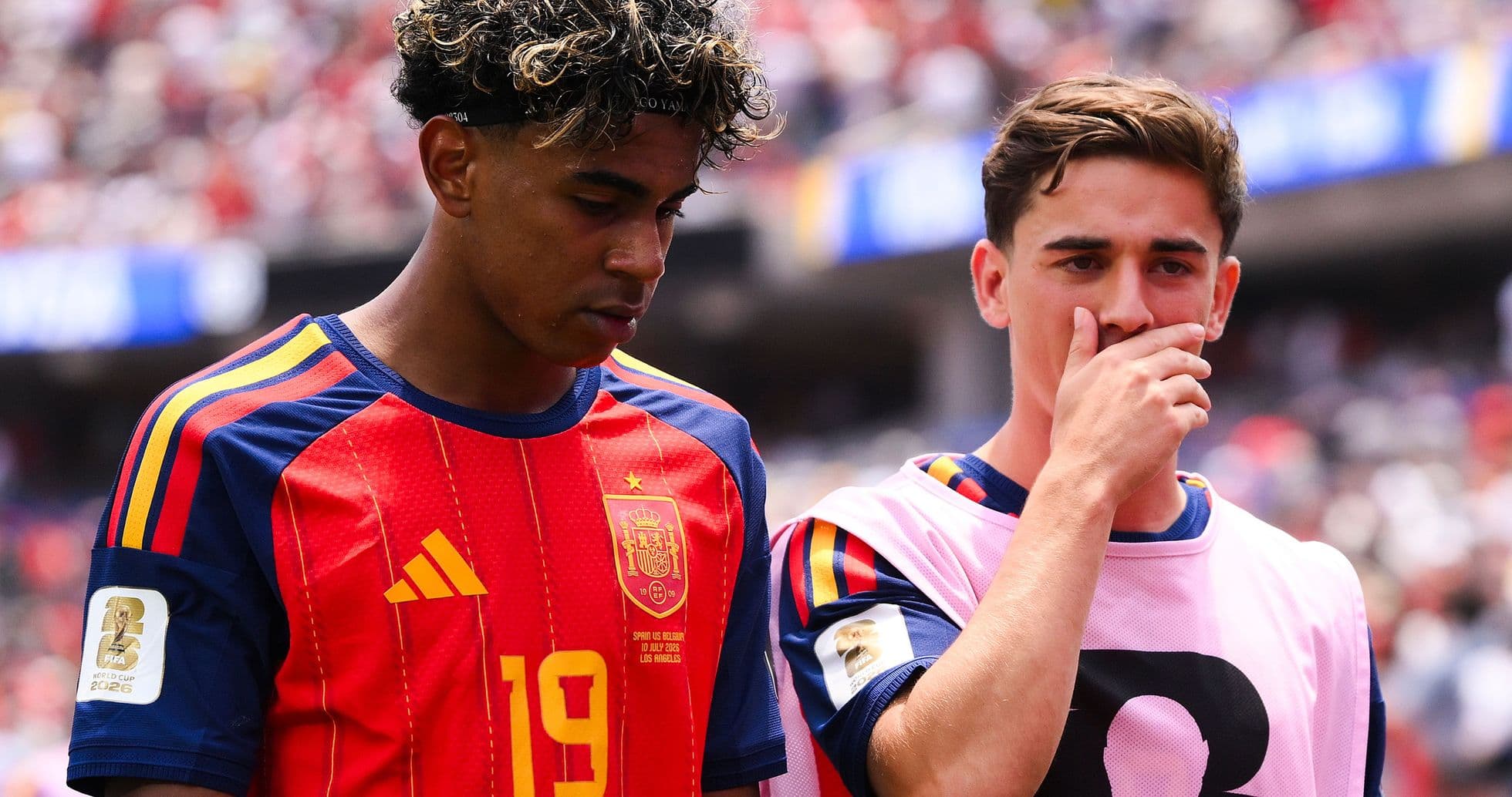 Two Spanish players on the sidelines during match Two Spanish players on the sidelines during match