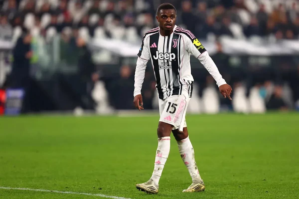 Player wearing Juventus kit on the field Player wearing Juventus kit on the field