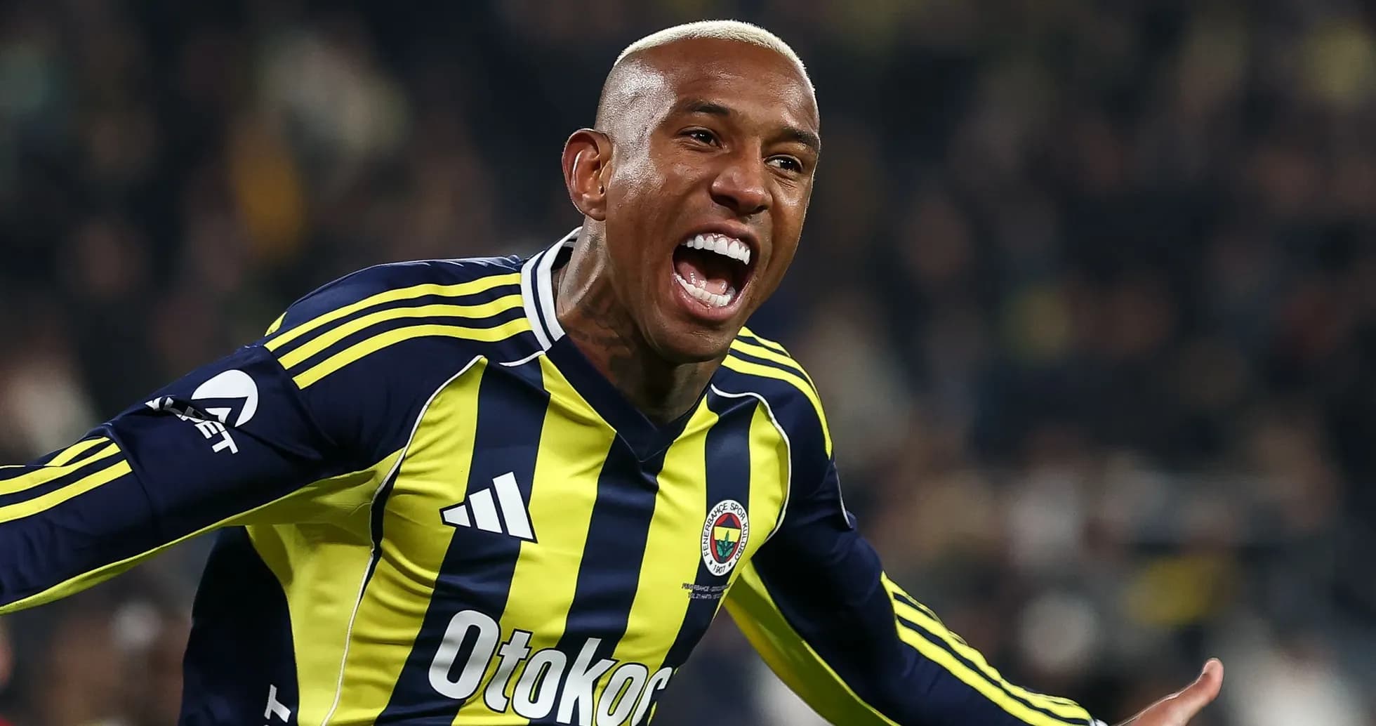 Player celebrating a goal in Fenerbahçe jersey Player celebrating a goal in Fenerbahçe jersey