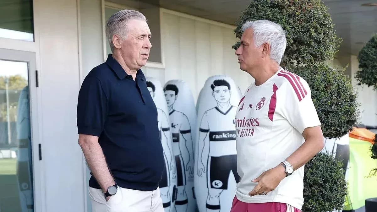 Two coaches talking at a training facility Two coaches talking at a training facility