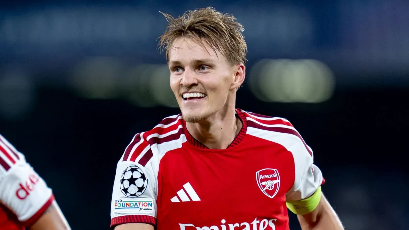 Player celebrating after scoring for Arsenal Player celebrating after scoring for Arsenal
