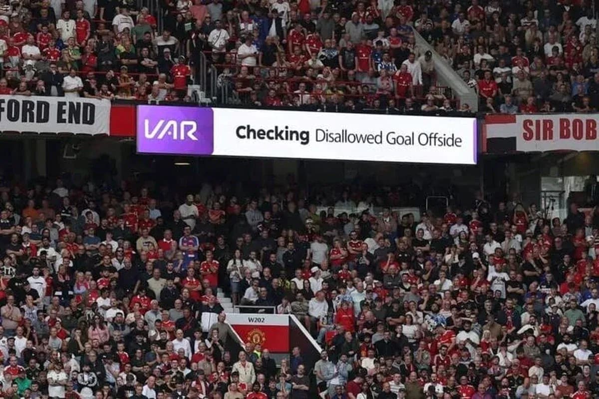 Fans watching VAR announcement for disallowed goal Fans watching VAR announcement for disallowed goal