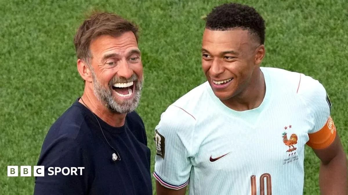 Two men smiling on the football field Two men smiling on the football field
