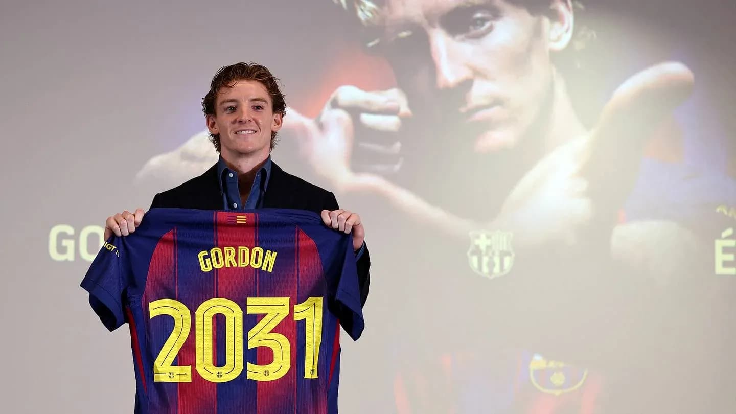 Player holding Barcelona jersey with 'Gordon' and '2031' Player holding Barcelona jersey with 'Gordon' and '2031'