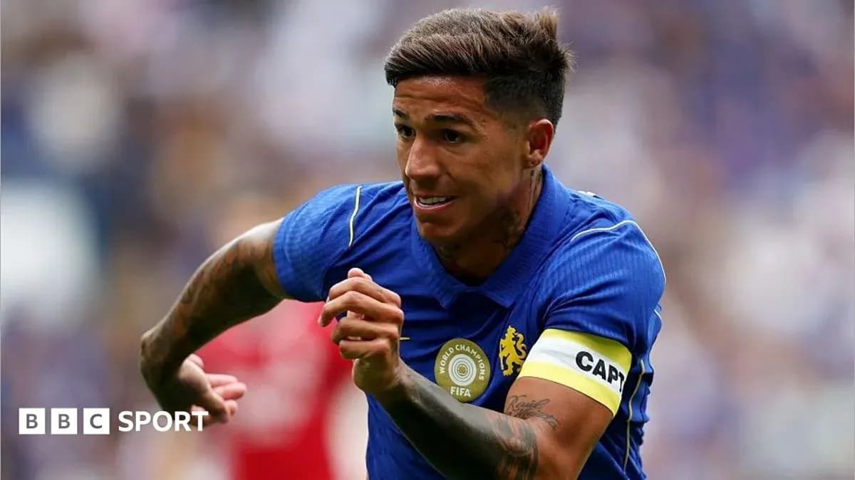 Player running with ball wearing captain's armband Player running with ball wearing captain's armband