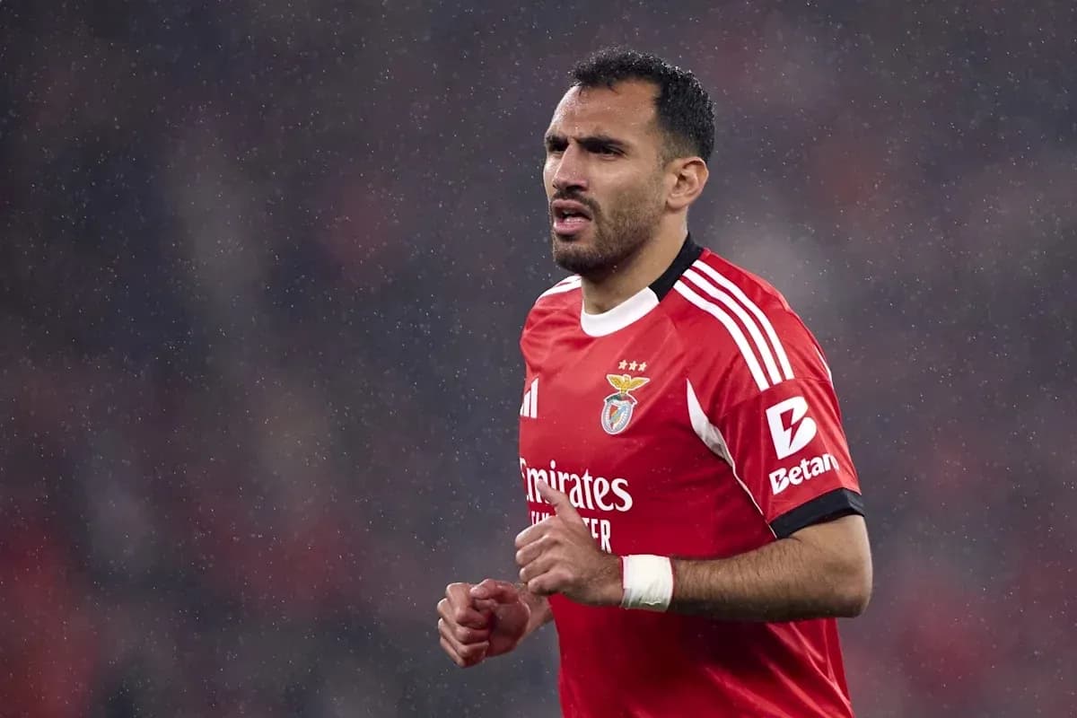 Player in red jersey during rainy match Player in red jersey during rainy match