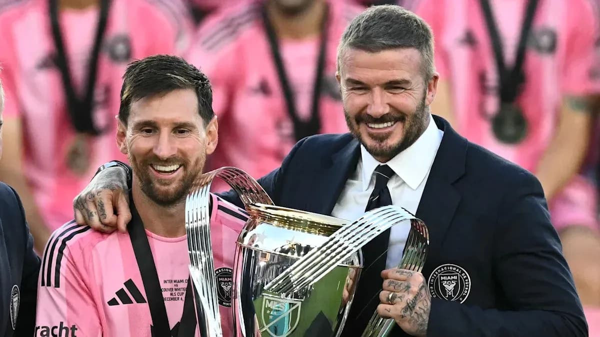 Lionel Messi and David Beckham celebrating with trophy Lionel Messi and David Beckham celebrating with trophy