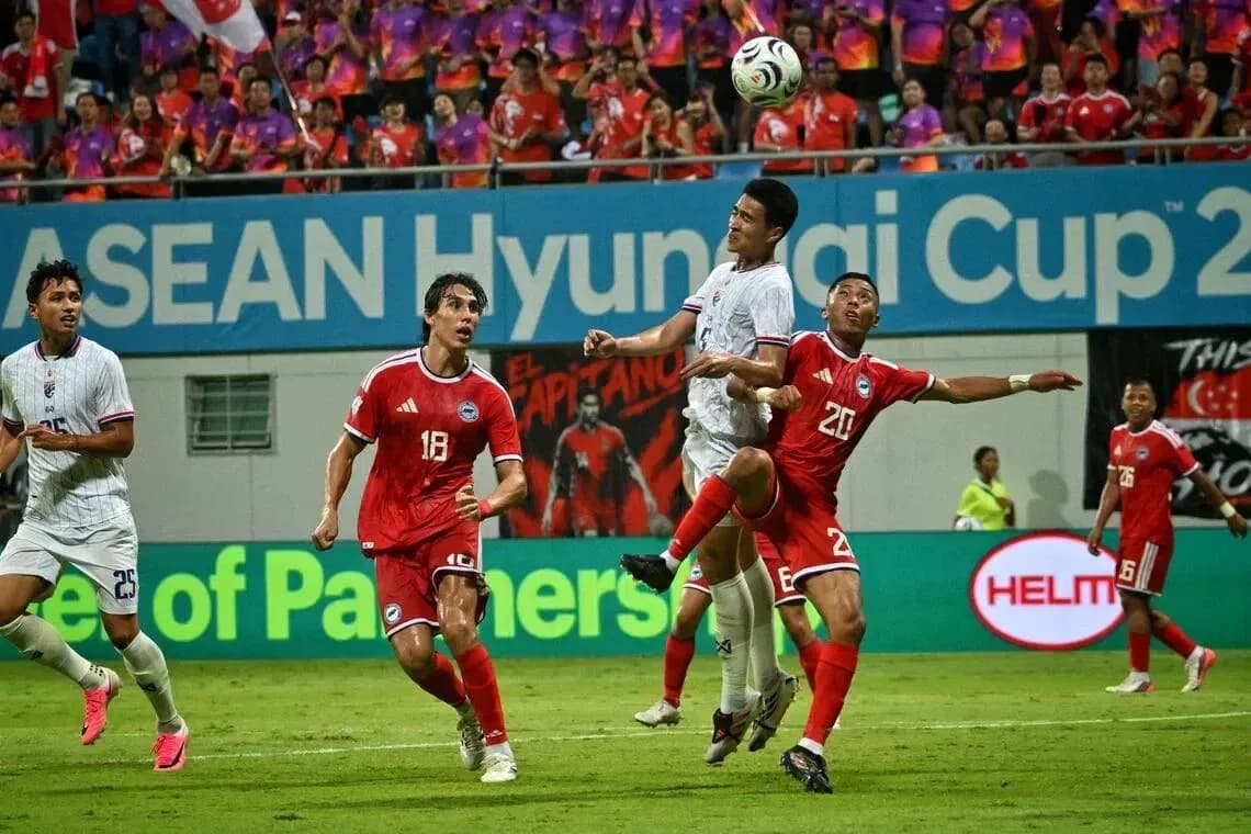 Players contesting a high ball during a match Players contesting a high ball during a match