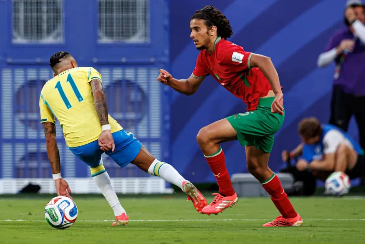 Player from Brazil dribbling past Moroccan defender Player from Brazil dribbling past Moroccan defender