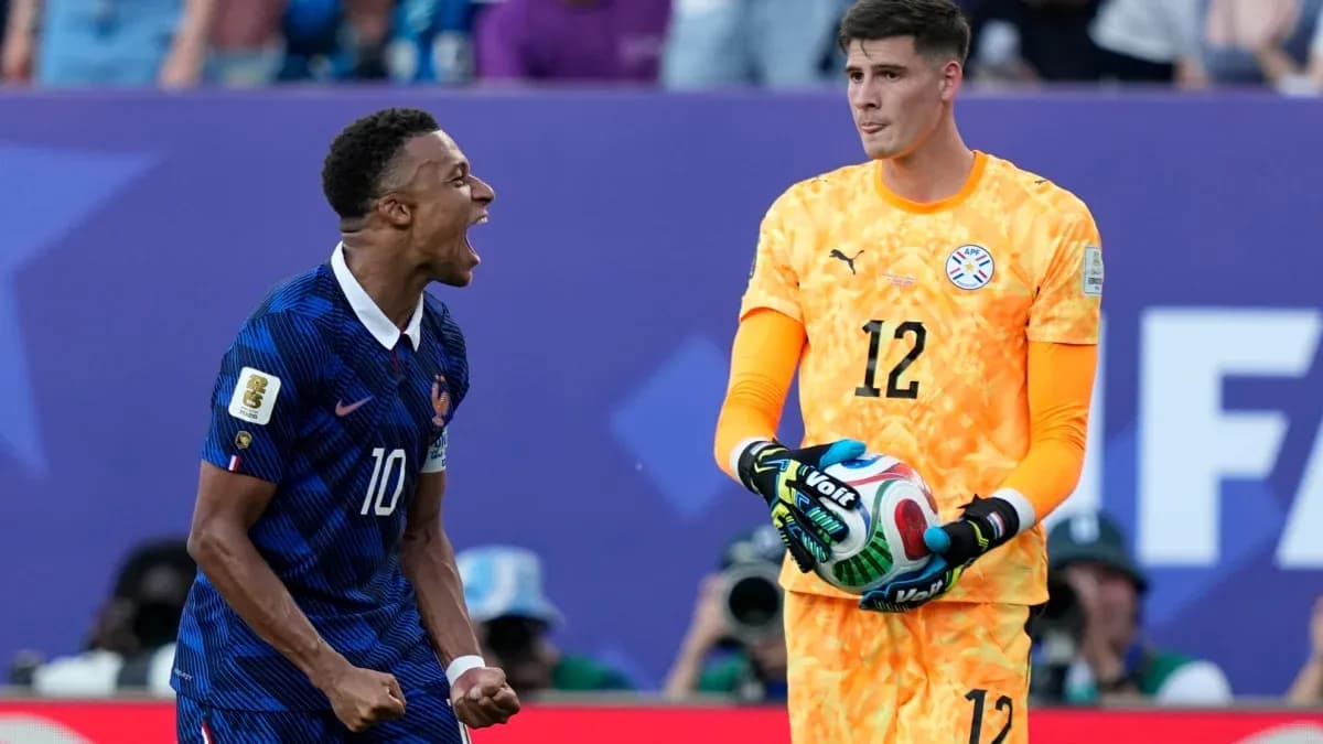 French player celebrating near Paraguayan goalkeeper French player celebrating near Paraguayan goalkeeper