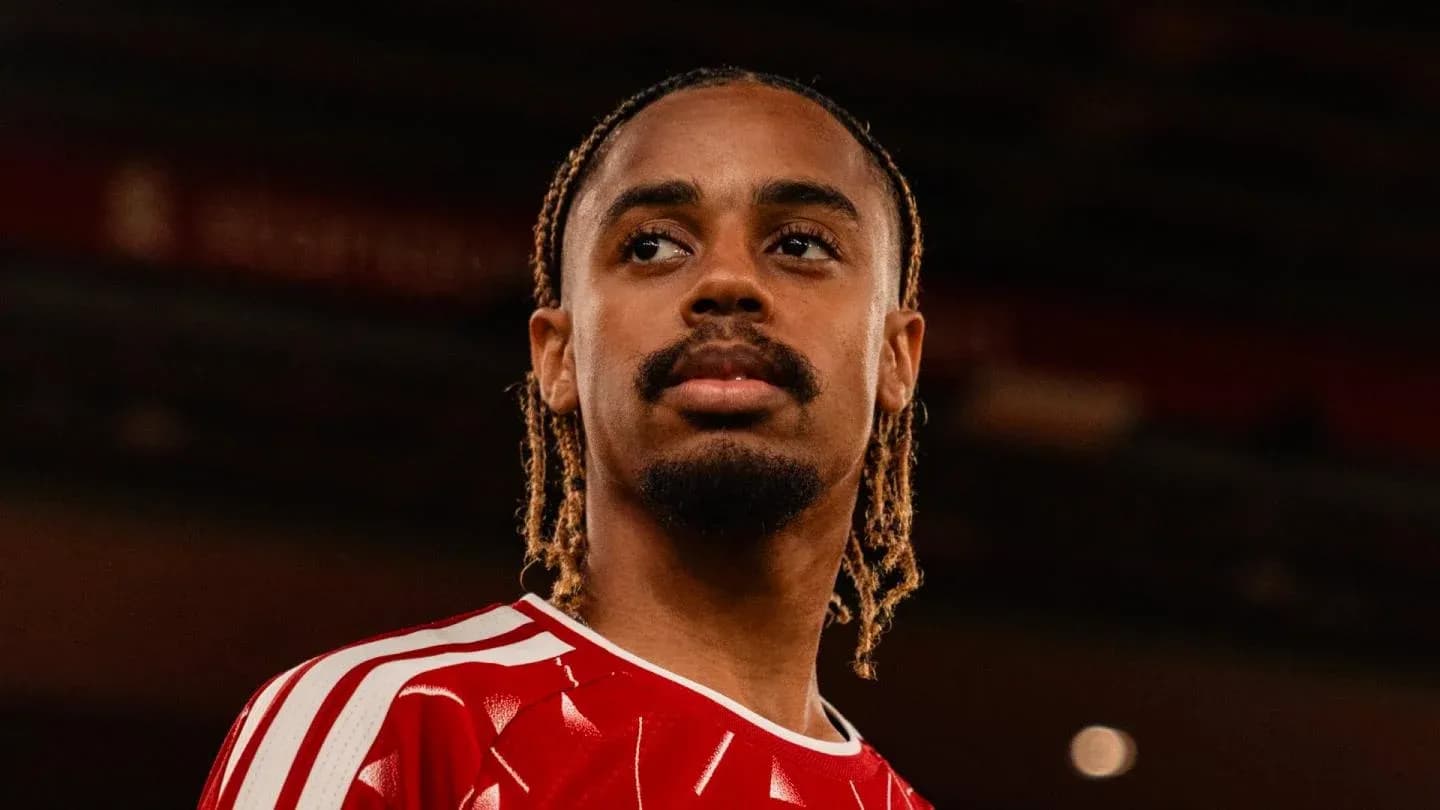 Player wearing red jersey posing for photo Player wearing red jersey posing for photo