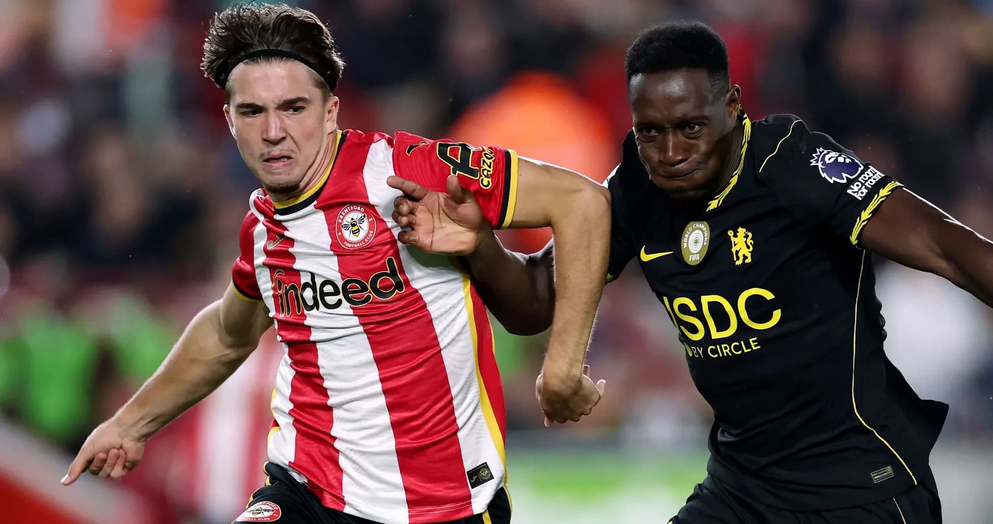 Brentford player racing against Chelsea player Brentford player racing against Chelsea player