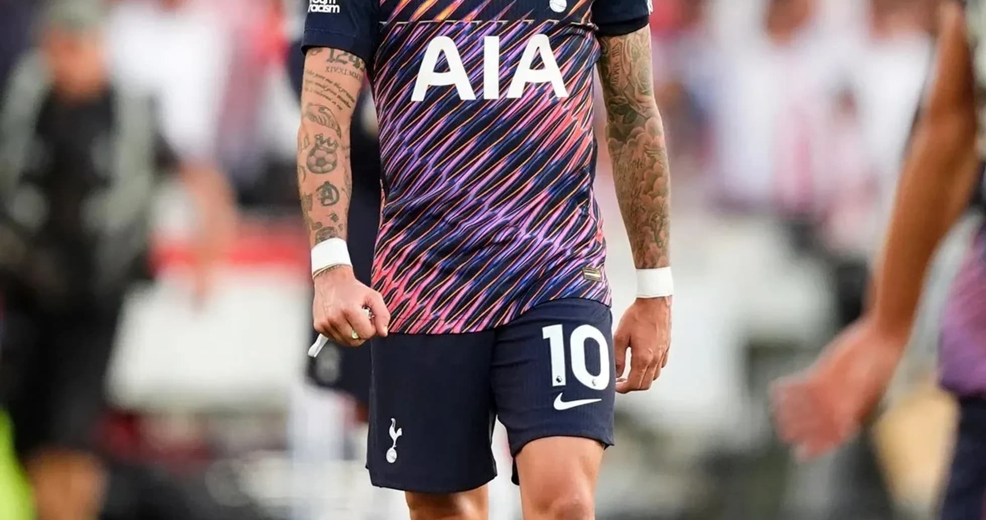 Player wearing Tottenham jersey on the field Player wearing Tottenham jersey on the field