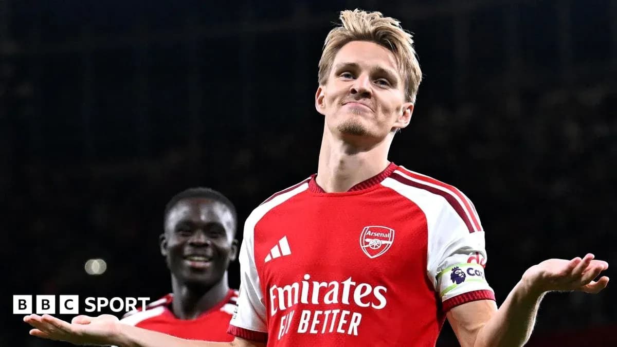 Arsenal player celebrating during match with teammate Arsenal player celebrating during match with teammate