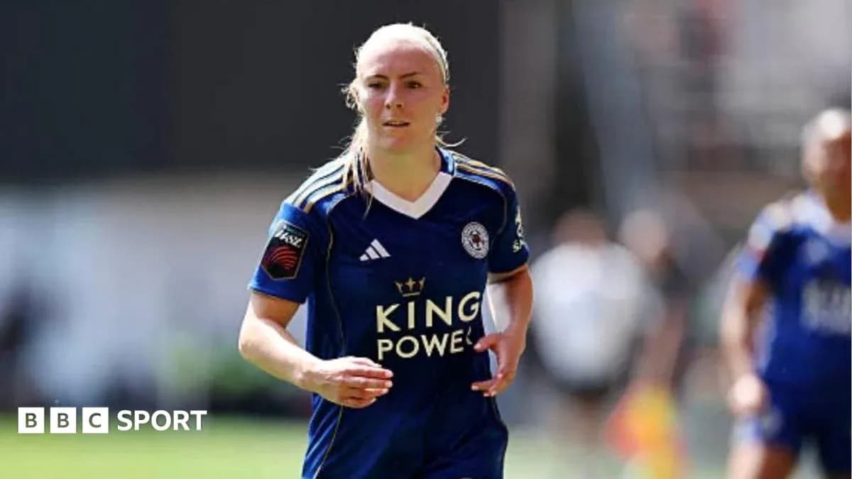Player running in Leicester City jersey on field Player running in Leicester City jersey on field