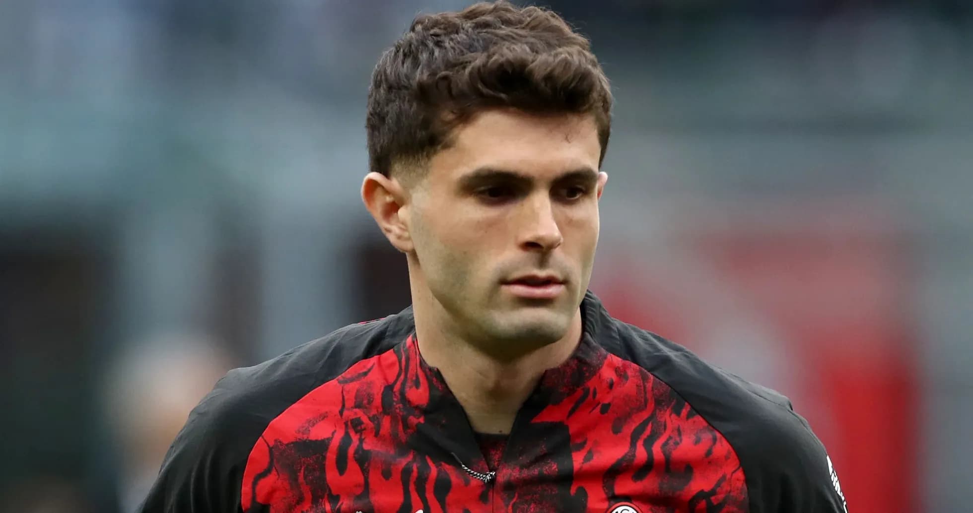 Player walking on the field in AC Milan jersey Player walking on the field in AC Milan jersey