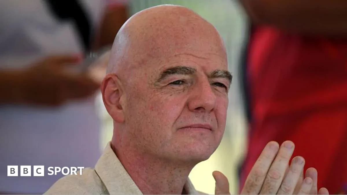 Man with bald head and clasped hands in audience Man with bald head and clasped hands in audience