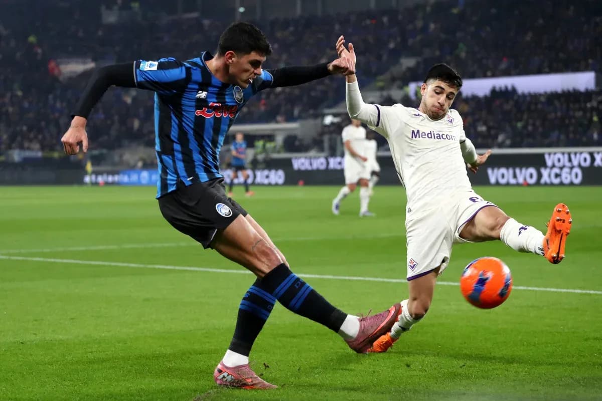 Fiorentina player challenging Atalanta opponent for the ball Fiorentina player challenging Atalanta opponent for the ball