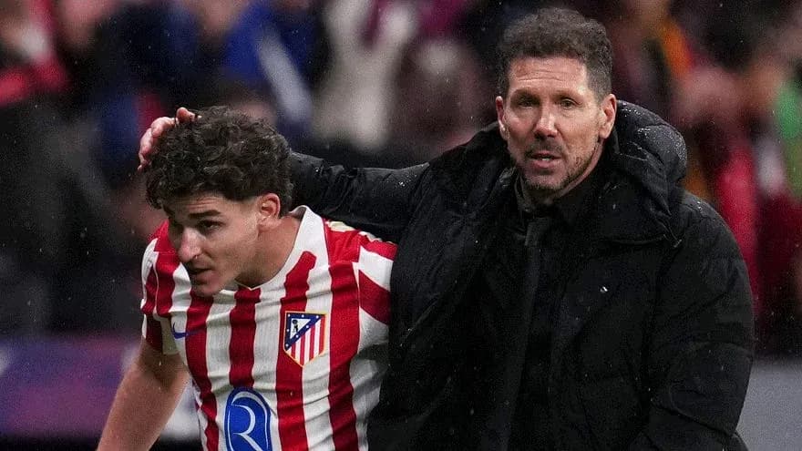 Atletico Madrid player receiving support from coach Atletico Madrid player receiving support from coach