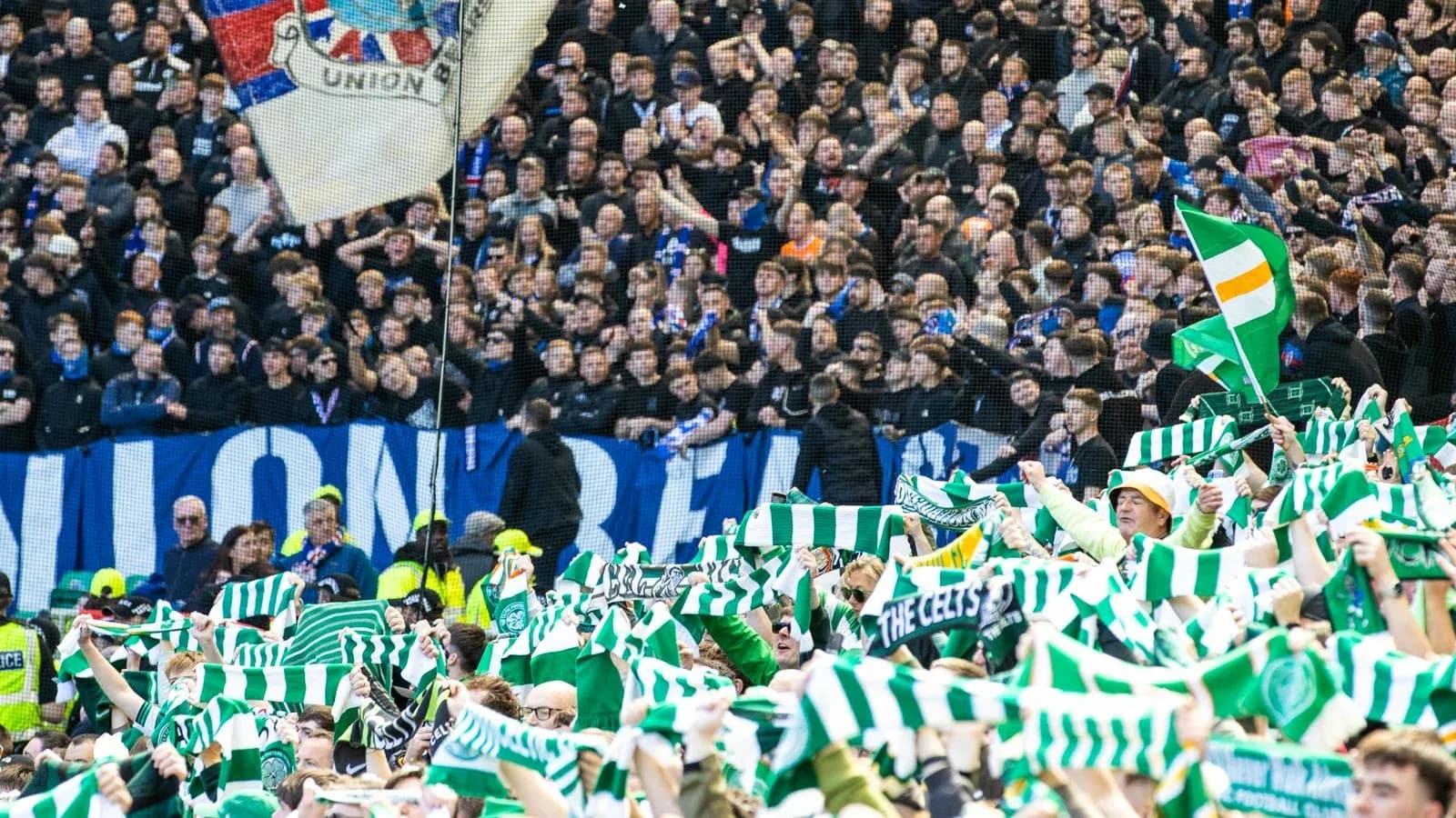 Fans waving scarves during a football match Fans waving scarves during a football match