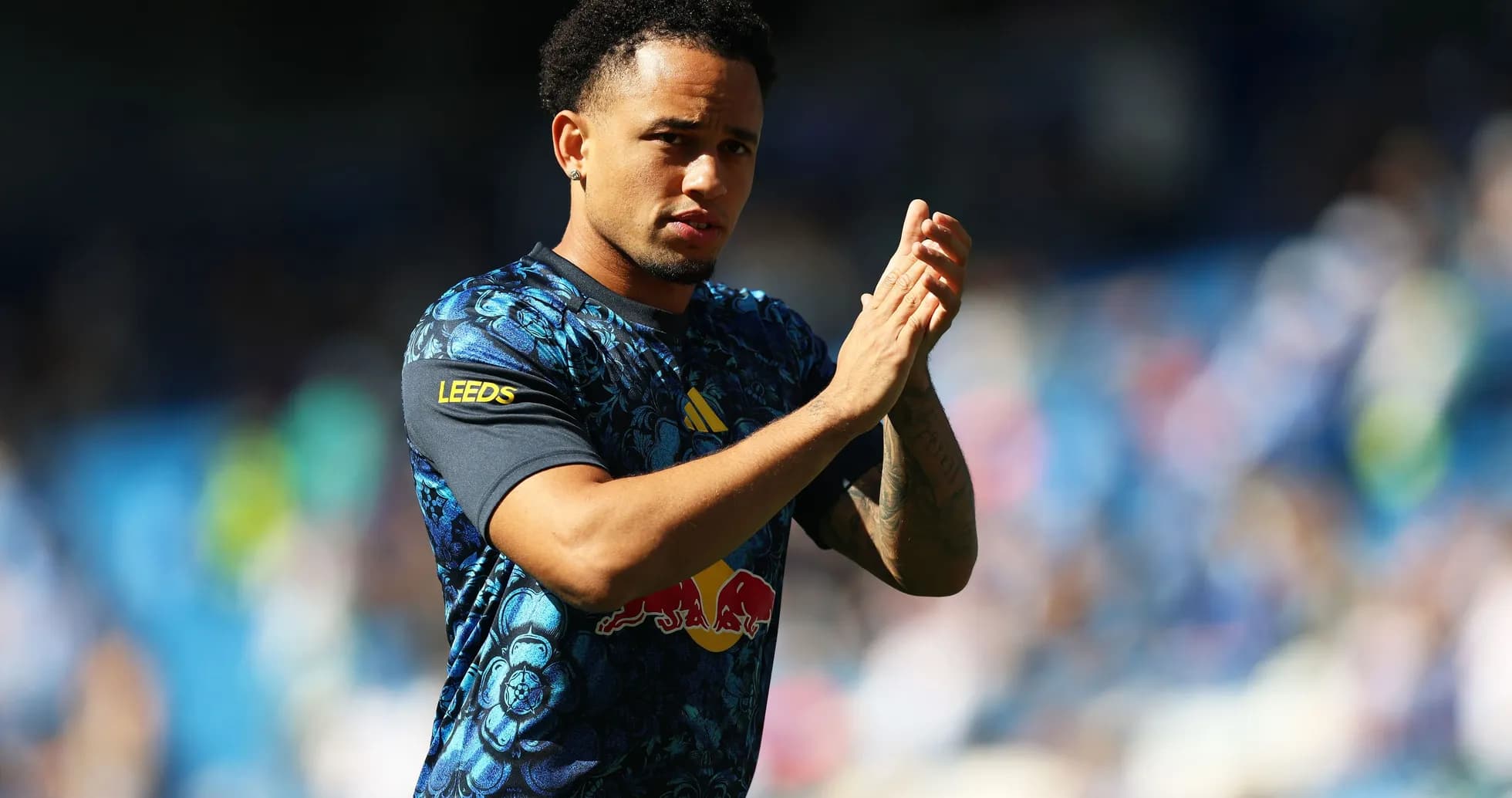 Player applauding fans during match warm-up Player applauding fans during match warm-up