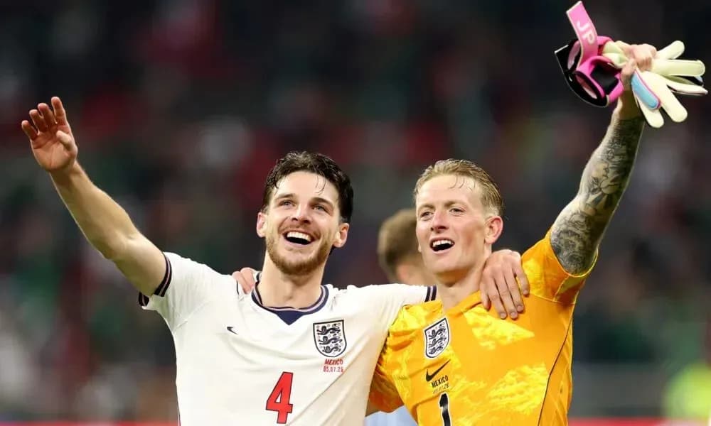 Two England players celebrating a victory together Two England players celebrating a victory together