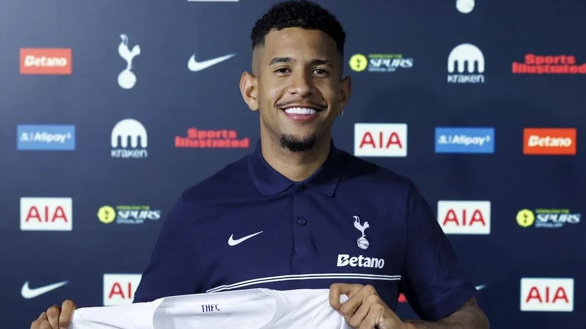 Player holding Tottenham Hotspur jersey during signing event Player holding Tottenham Hotspur jersey during signing event