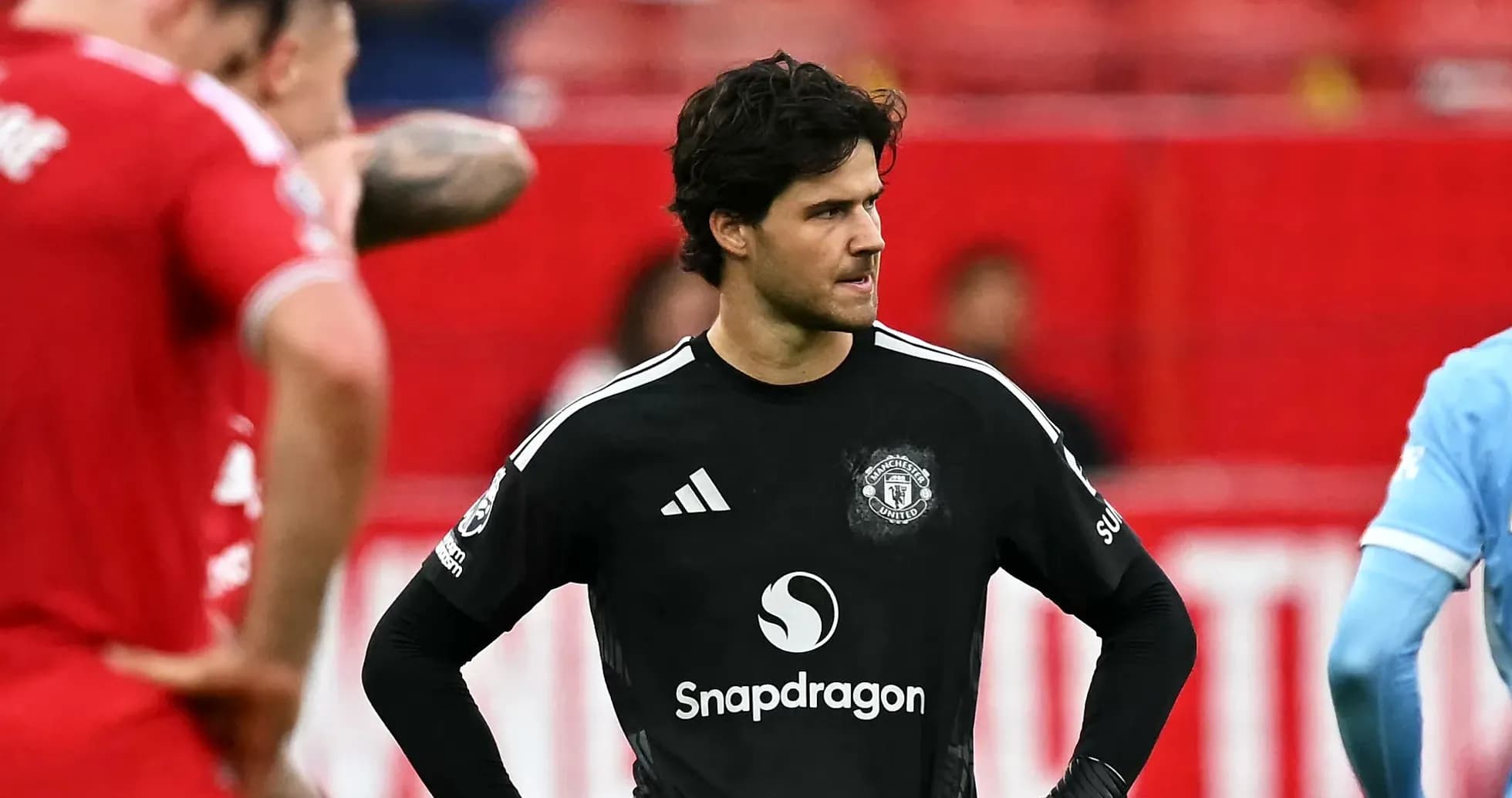 Goalkeeper in black jersey during match moment Goalkeeper in black jersey during match moment
