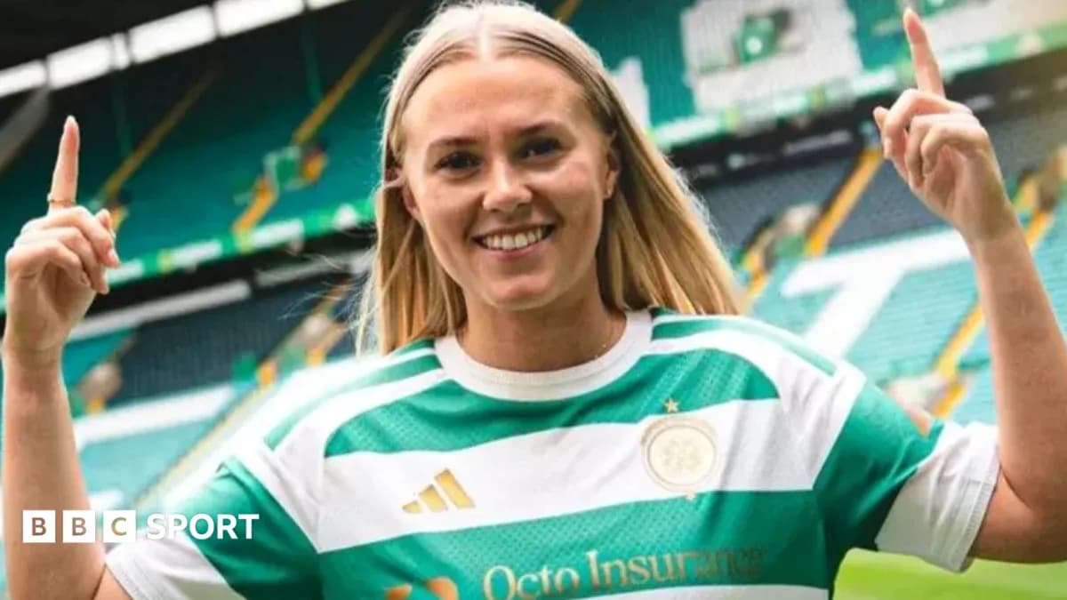 Player posing in Celtic jersey at stadium Player posing in Celtic jersey at stadium
