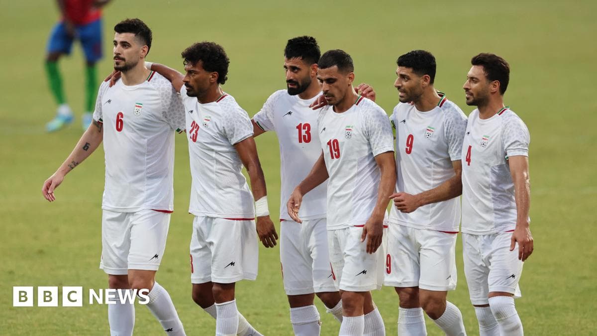 Iranian football players celebrating together on the field Iranian football players celebrating together on the field