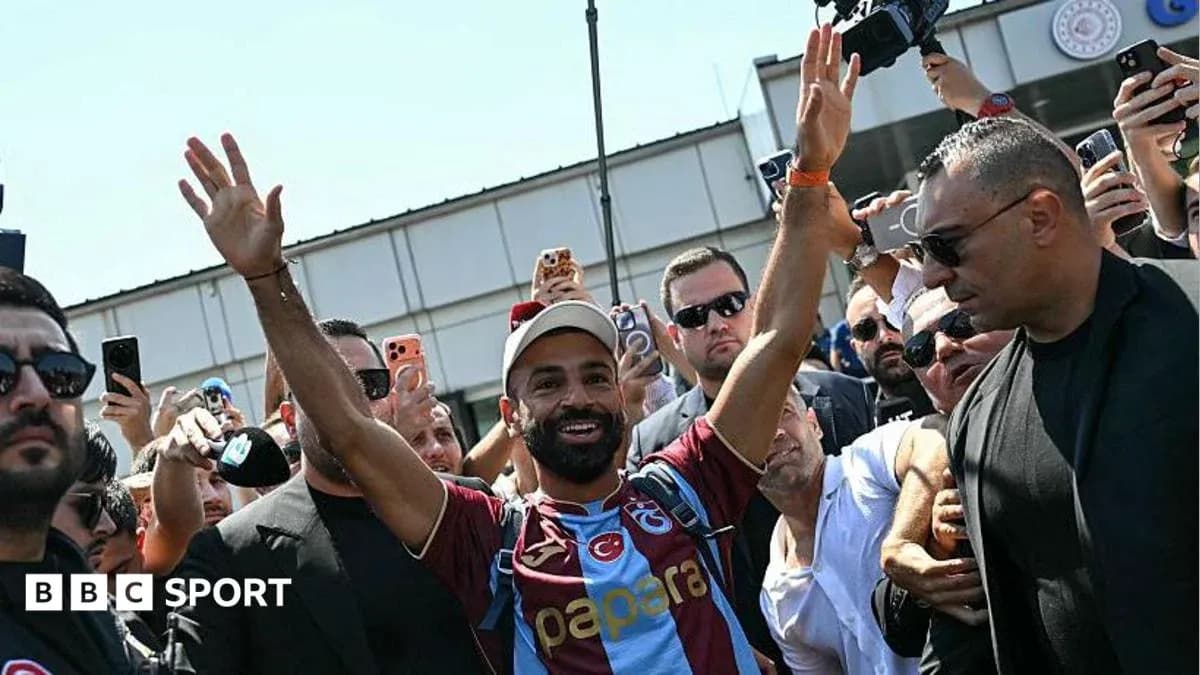Player waving to fans during arrival at stadium Player waving to fans during arrival at stadium