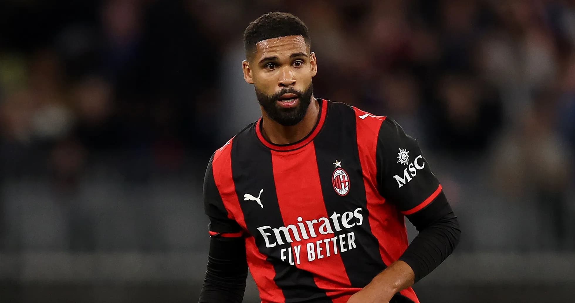 Player in AC Milan jersey during a match Player in AC Milan jersey during a match