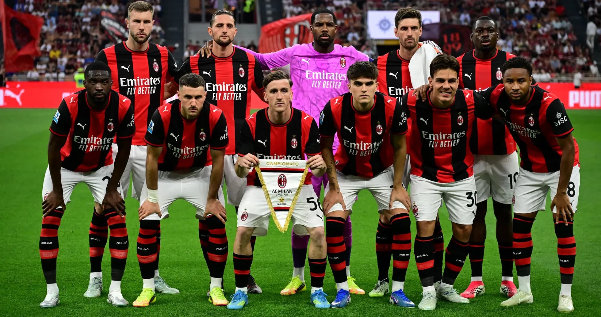AC Milan players posing with championship banner AC Milan players posing with championship banner