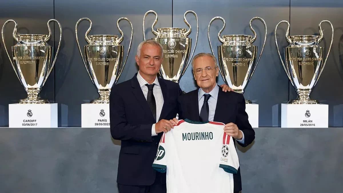 Jose Mourinho holding jersey with Florentino Perez Jose Mourinho holding jersey with Florentino Perez