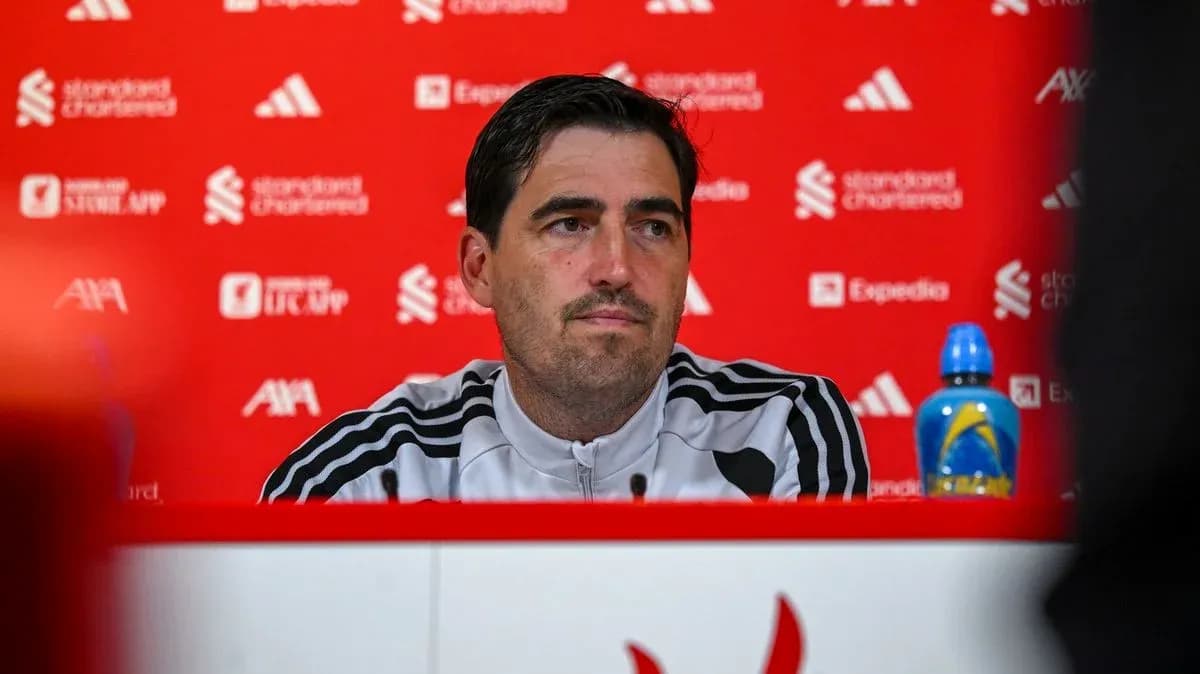 Manager at press conference with branded backdrop Manager at press conference with branded backdrop