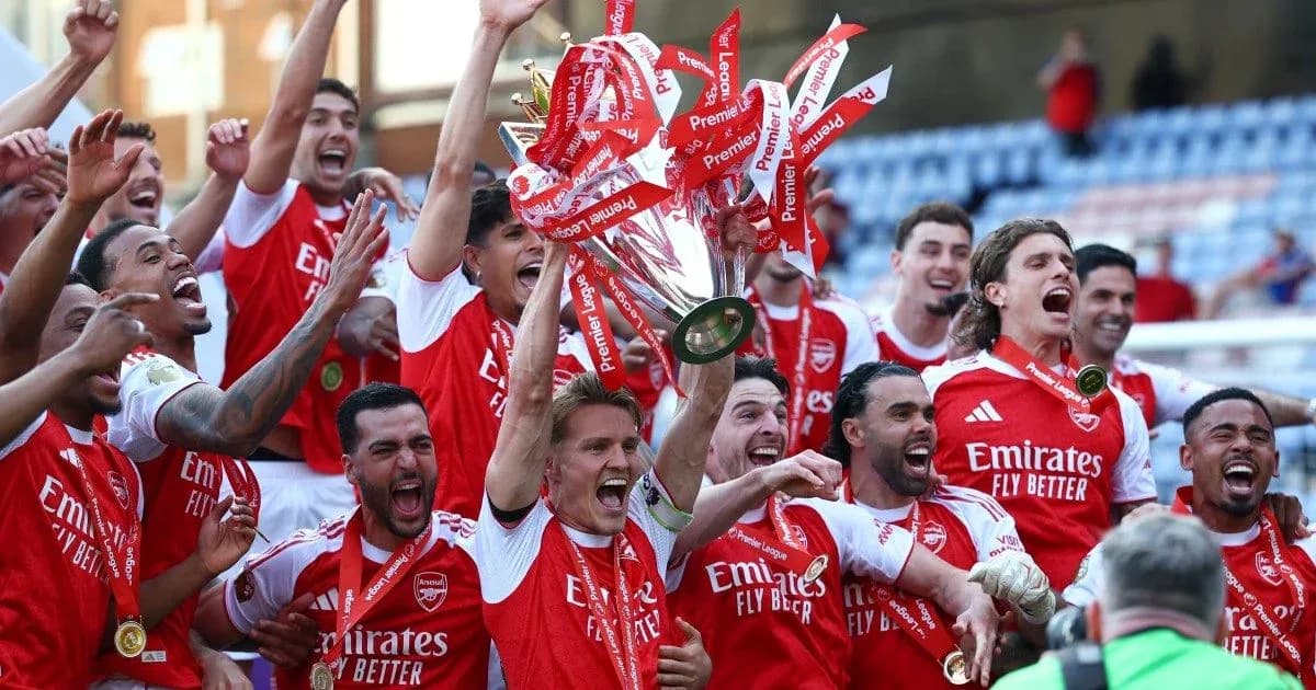 Arsenal players celebrating Premier League trophy victory Arsenal players celebrating Premier League trophy victory