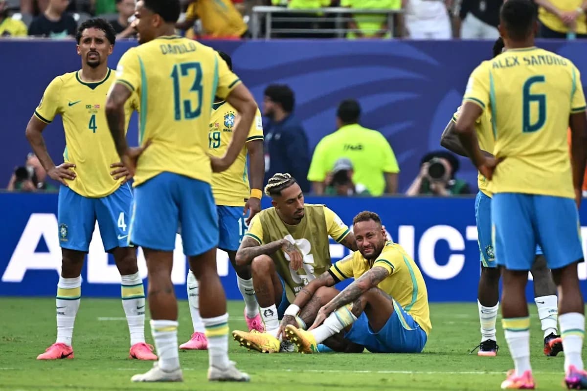 Brazilian players gathered around injured Neymar on field Brazilian players gathered around injured Neymar on field