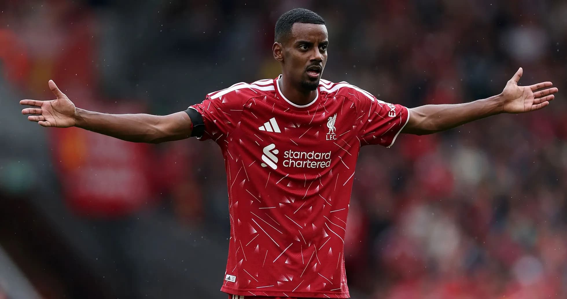Player gesturing during a match in Liverpool kit Player gesturing during a match in Liverpool kit