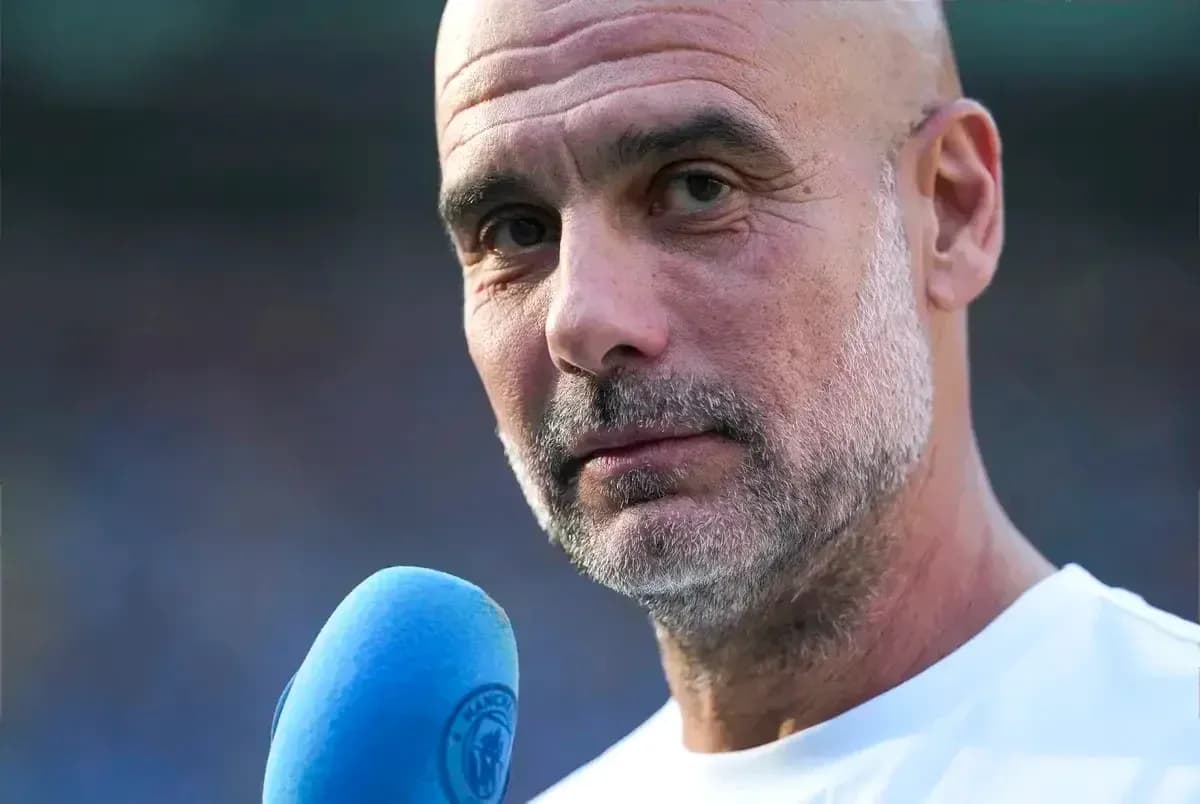 Coach speaking into microphone during interview Coach speaking into microphone during interview