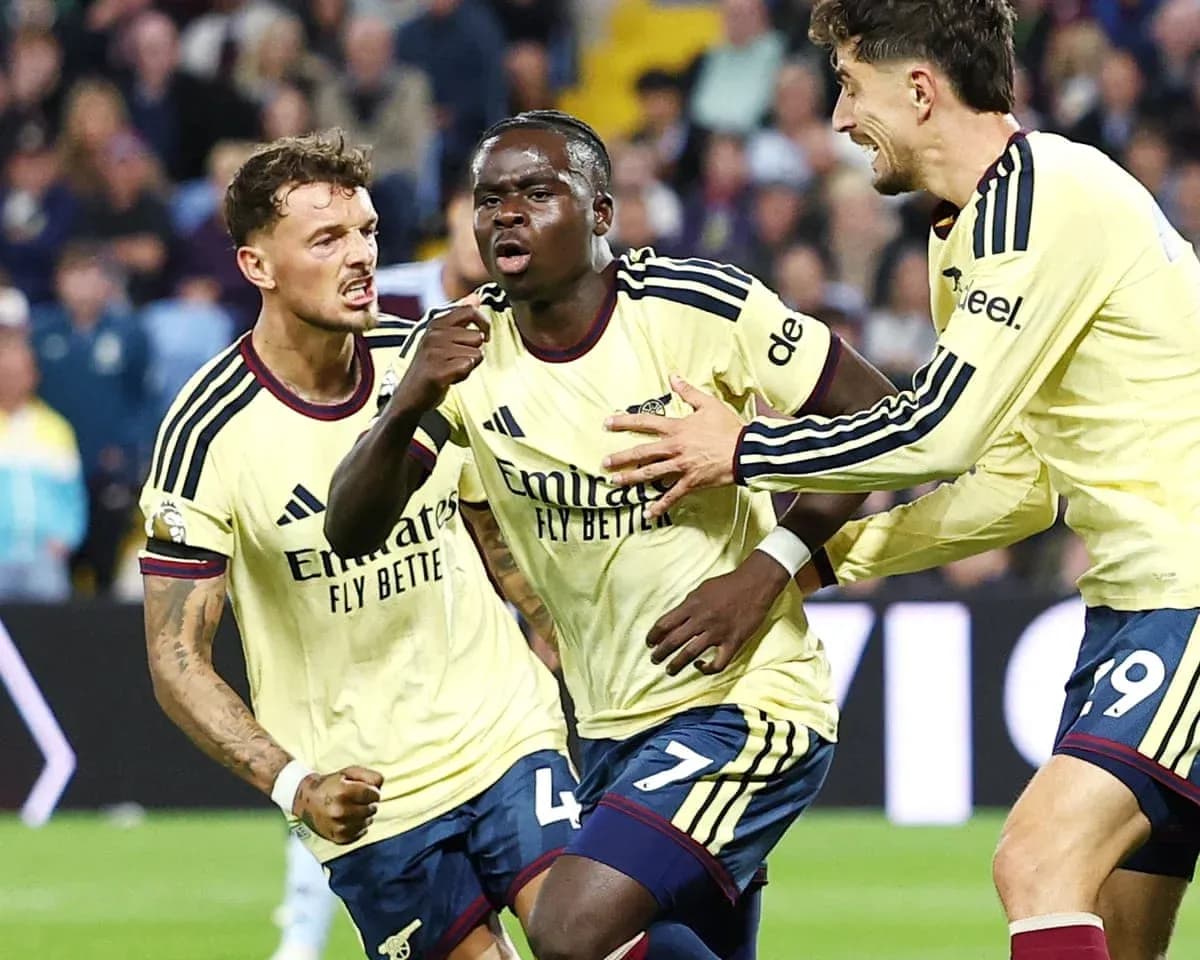 Arsenal players celebrating a goal in match Arsenal players celebrating a goal in match