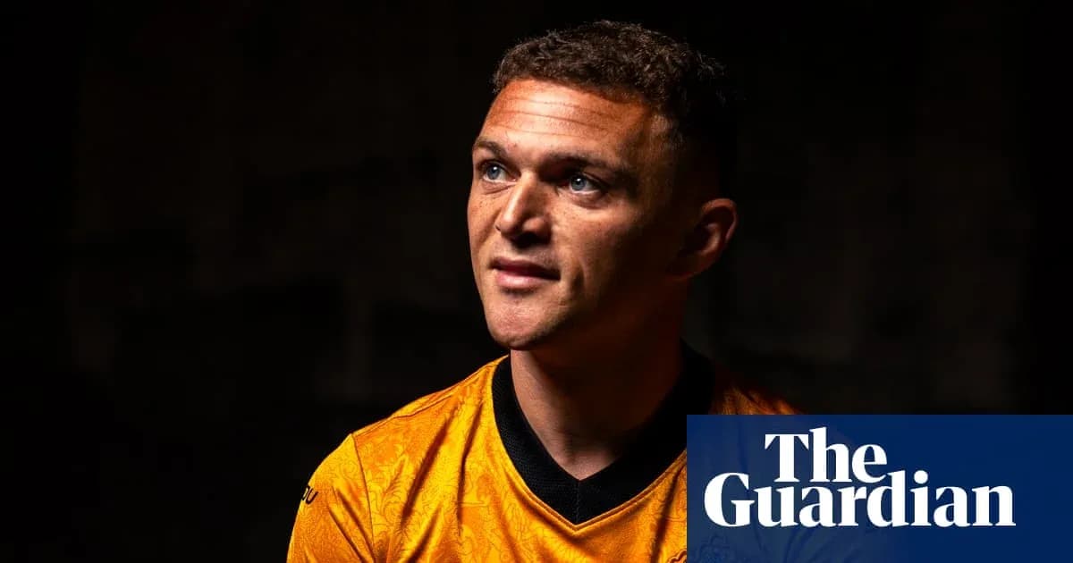 Player in orange jersey looking upward during interview Player in orange jersey looking upward during interview