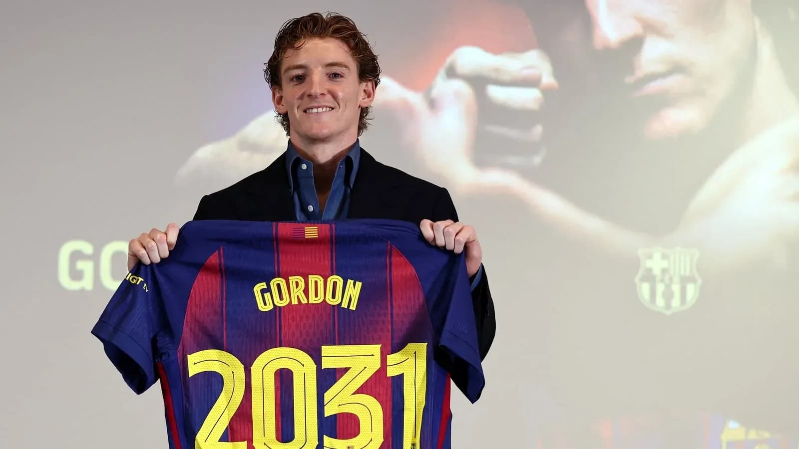 Player holding Barcelona jersey with name and number Player holding Barcelona jersey with name and number