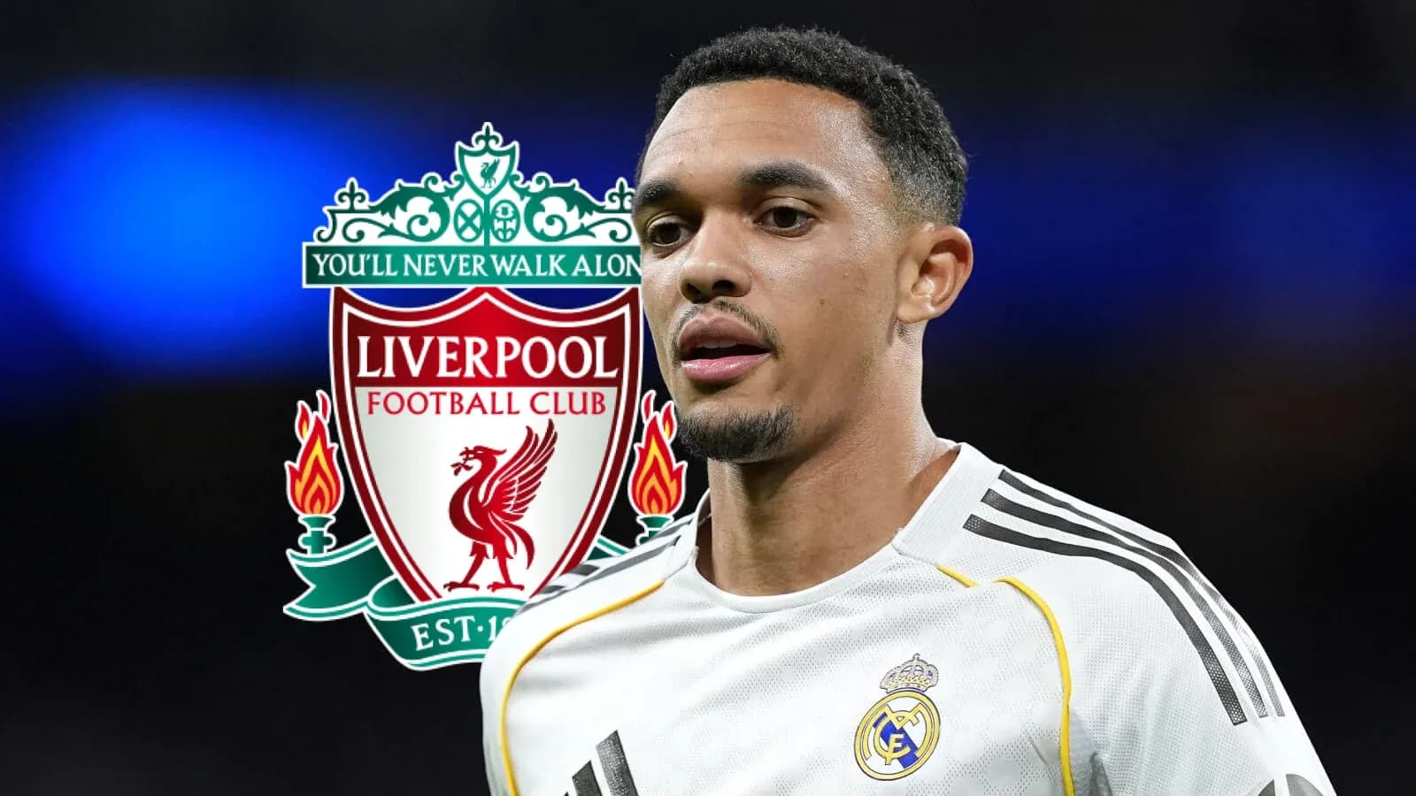 Player in white jersey with Liverpool logo in background Player in white jersey with Liverpool logo in background