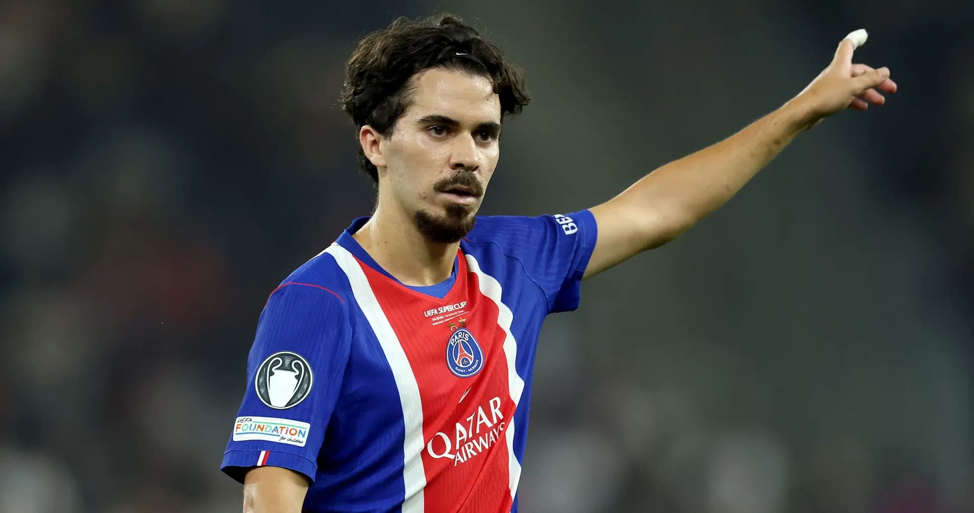 Player gesturing during match wearing PSG jersey Player gesturing during match wearing PSG jersey